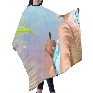 Personality  Cropped Image Of Smiling Woman In Swimwear Holding Cocktail In Coconut Shell Near Palm Branches In Front Of Sea  Hair Cutting Cape