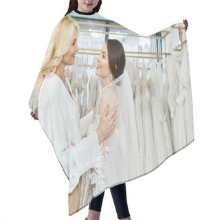 Personality  A Young Brunette Bride And Her Middle-aged Mother Are Standing Next To Each Other In Front Of A Rack Of Dresses In A Bridal Salon. Hair Cutting Cape