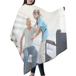 Personality  Smiling Nurse Assisting Senior Man To Get Up From Bed. Caring Nurse Supporting Patient While Getting Up From Bed And Move Towards Wheelchair At Home. Helping Elderly Disabled Man Standing Up In His Bedroom. Hair Cutting Cape