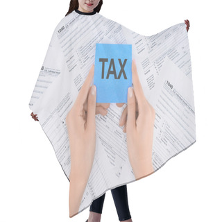 Personality  Cropped View Of Woman Holding Blue Card With Word 'tax' And Documents On Background  Hair Cutting Cape
