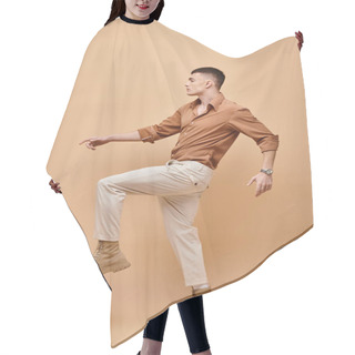 Personality  Side View Photo Of Young Man In Beige Shirt, Pants And Boots Posing On Beige Background Hair Cutting Cape