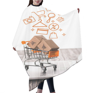 Personality  Selective Focus Of Toy Shopping Cart With Small Carton Boxes On Laptop Keyboard Near Illustration On White, E-commerce Concept Hair Cutting Cape