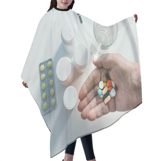Personality  Close-up View Of Senior Man Hand Holding A Bunch Of Pills Hair Cutting Cape