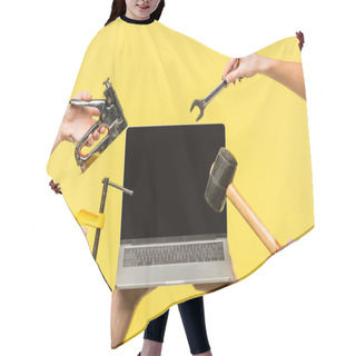 Personality  Cropped Shot Of Hands Holding Tools And Laptop With Blank Screen Isolated On Yellow  Hair Cutting Cape