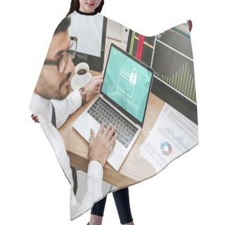 Personality  Selective Focus Of Bi-racial Trader Using Laptop With Secure Payment Letters  Hair Cutting Cape