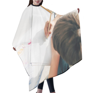 Personality  Top View Of Kid With Dyslexia Drawing With Pencil  Hair Cutting Cape