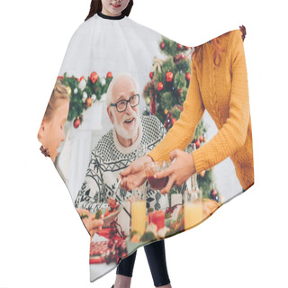 Personality  Selective Focus Of Happy Grandfather Sitting At Festive Table With Family Hair Cutting Cape