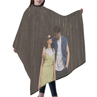 Personality  Fashionable Brunette Man In Sunglasses And Denim Vest Hugging Smiling Girlfriend In Sundress And Holding Hand In Pocket While Standing Near Wooden House, Countryside Exploration Concept Hair Cutting Cape