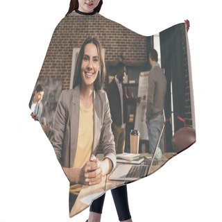 Personality  Smiling Business Woman Sitting At Desk With Laptop And Working On Project At Loft Office With Colleagues On Background Hair Cutting Cape