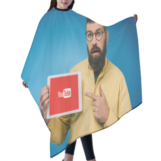 Personality  Surprised Bearded Man Pointing At Digital Tablet With Youtube App, Isolated On Blue  Hair Cutting Cape
