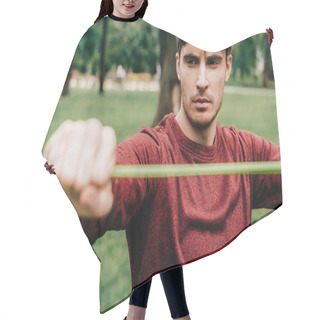 Personality  Selective Focus Of Handsome Man Exercising With Resistance Band In Park  Hair Cutting Cape