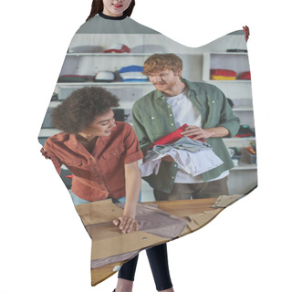 Personality  Smiling Young African American Craftswoman Working With Fabric And Sewing Patterns Near Colleague Holding Clothes In Blurred Print Studio, Ambitious Young Entrepreneurs Concept  Hair Cutting Cape
