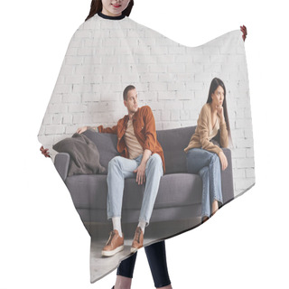 Personality  Young Man Looking At Offended Asian Wife While Sitting On Couch In Living Room, Divorce Concept Hair Cutting Cape