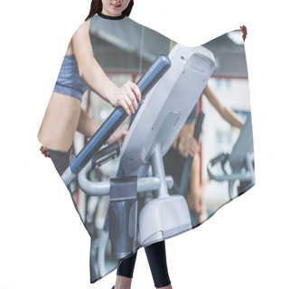 Personality  Cropped Shot Of Sportive Woman Working Out On Elliptical Machine At Gym Hair Cutting Cape