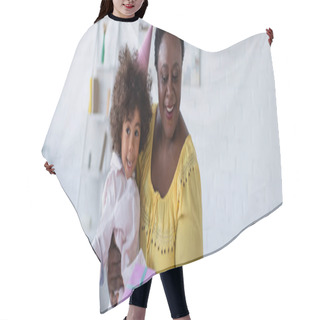 Personality  Joyful Middle Aged African American Woman Holding Granddaughter In Party Cap And Gift Box, Banner Hair Cutting Cape