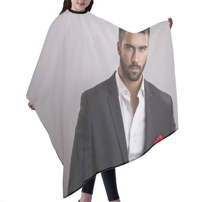 Personality  Elegant young handsome man. Studio fashion portrait. hair cutting cape