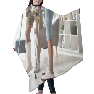 Personality  Cropped View Of Woman Standing Near Man Holding Crutches At Home  Hair Cutting Cape