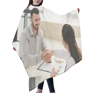 Personality  Smiling Client Shaking Hands With Doctor In Office With Laptop And Insurance Claim Form Hair Cutting Cape