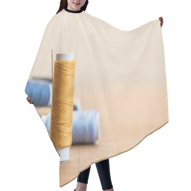 Personality  Selective Focus Of Cotton Thread Coil With Needle Isolated On Beige With Copy Space Hair Cutting Cape