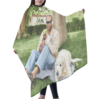 Personality  An African American Man With Myasthenia Gravis Syndrome Sits In The Grass Next To A Labrador Dog And An Apple. Hair Cutting Cape