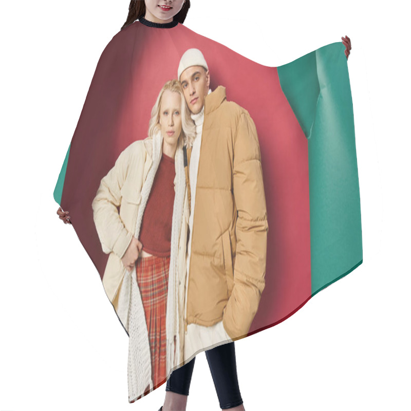 Personality  Attractive Woman And Man In Winter Outerwear Posing Together Near Torn Turquoise And Red Backdrop Hair Cutting Cape