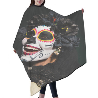Personality  Cheerful Woman With Santa Muerte Makeup Touching Skull On Dark Green Background  Hair Cutting Cape
