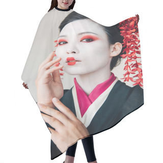 Personality  Beautiful Geisha In Black Kimono With Red Flowers In Hair Touching Face Isolated On White Hair Cutting Cape