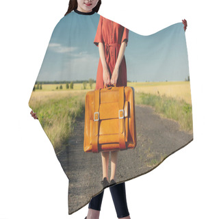 Personality  Girl In Red Dress With Suitcase On Country Road In Sunset. Low Side View Hair Cutting Cape