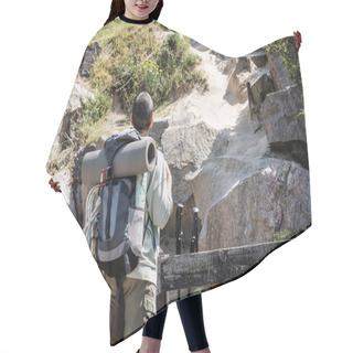 Personality  Back View Of Short Haired Young Traveler With Backpack And Travel Equipment Standing Near Hill With Stones And Green Grass At Background During Summer, Woman Trekking Across Vast Landscapes Hair Cutting Cape