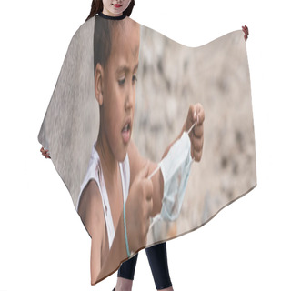 Personality  Panoramic Shot Of Poor African American Kid Holding Dirty Medical Mask Outside Hair Cutting Cape