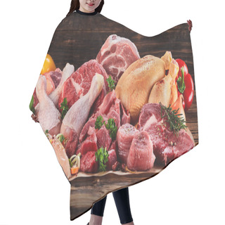 Personality  Raw Meat Assortment On Cooking Paper With Greens And Vegetables, Viewed In Close-up On Wooden Table Hair Cutting Cape