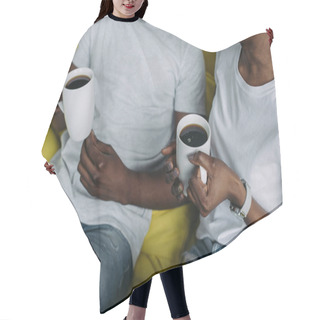 Personality  Cropped Shot Of Young African American Couple Holding Cups Of Coffee At Home Hair Cutting Cape