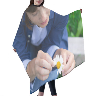 Personality  Pretty Young Woman In A Blue Shirt Is Guessing On A Camomile In The Meadow. Selective Focus. Close-up Hair Cutting Cape