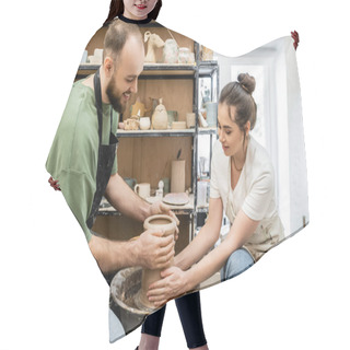 Personality  Positive Couple Of Potters Shaping Clay Vase On Pottery Wheel Together In Ceramic Studio Hair Cutting Cape