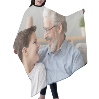 Personality  Smiling Senior Old Grandfather Embrace Little Boy Grandson At Home Hair Cutting Cape