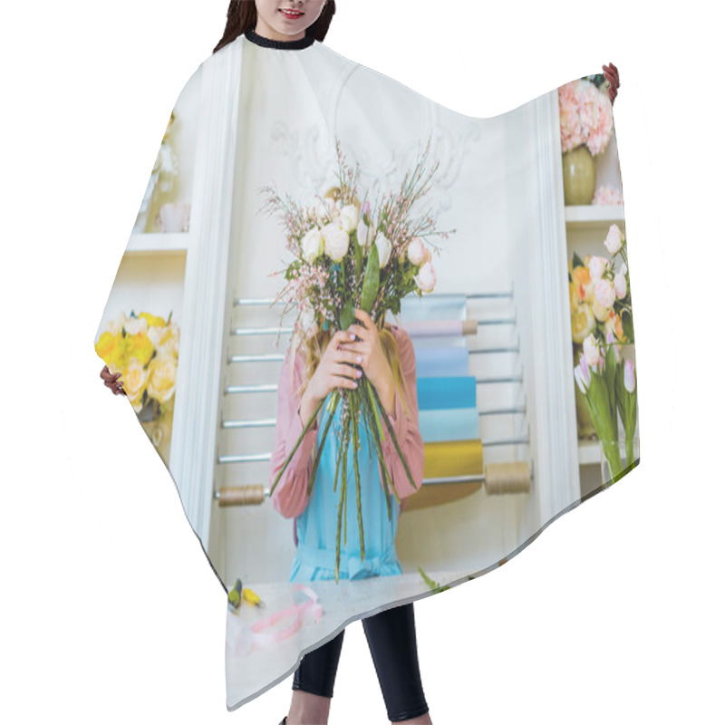 Personality  Female Florist Holding Bouquet In Front Of Face At Counter In Flower Shop Hair Cutting Cape