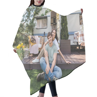 Personality  Smiling Woman Hugging Boyfriend And Looking At Camera On Terrace Of Camper Van  Hair Cutting Cape