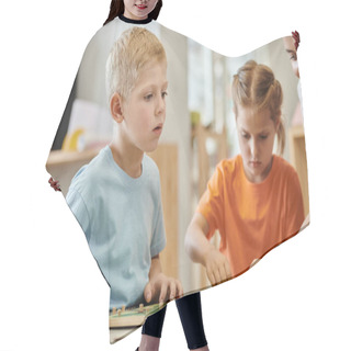 Personality  Boy Sitting Near Teacher And Didactic Materials During Lesson In Montessori School Hair Cutting Cape