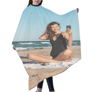 Personality  Happy Young Woman In Swimsuit Taking Selfie On Smartphone While Sitting On Beach Hair Cutting Cape