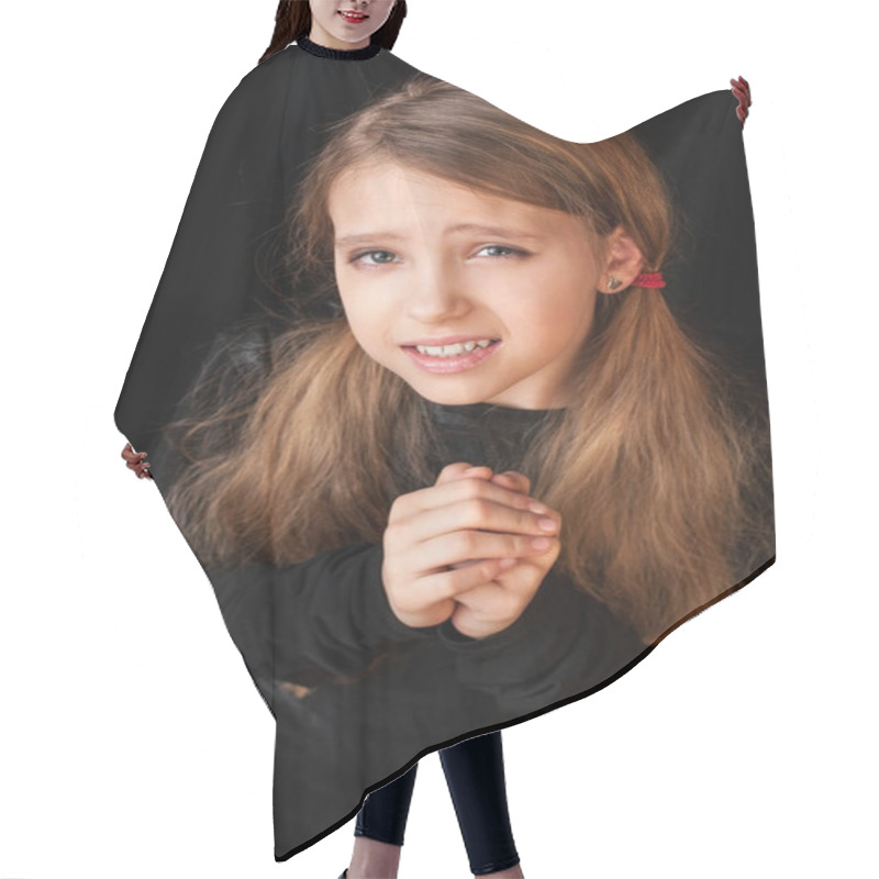 Personality  Portrait Of A Young Girl On A Black Background. She Has A Pleasing Facial Expression. She Prays. Vertical Hair Cutting Cape