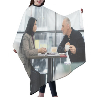 Personality  Side View Of Businessman And Asian Businesswoman Talking In Cafe  Hair Cutting Cape