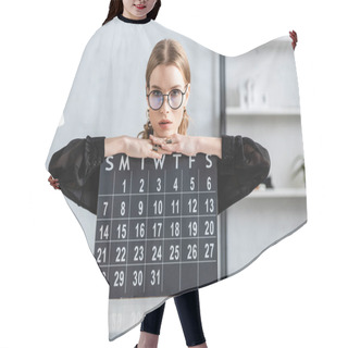 Personality  Beautiful Businesswoman In Black Clothes And Glasses Sitting On Chair And Holding A Calendar Hair Cutting Cape