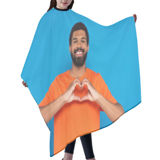 Personality  Happy And Bearded African American Man Showing Heart Sign With Hands Isolated On Blue Hair Cutting Cape