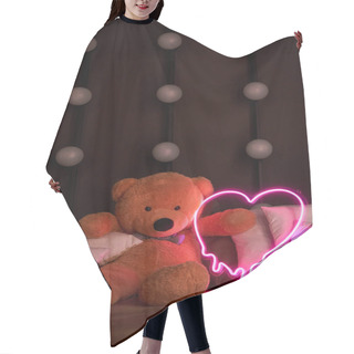 Personality  Cute Brown Teddy Bear Lies In Pillows, Holds A Brightly Glowing Neon Pink Heart. Valentine's Day 14 February, Gift Romantic Background. Declaration Of Love, Congratulations On Holiday Or Anniversary Hair Cutting Cape