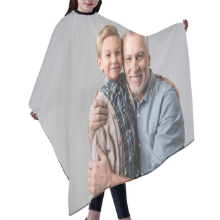 Personality  Happy Mature Man Embracing Smiling Grandson While Looking At Camera Isolated On Grey Hair Cutting Cape