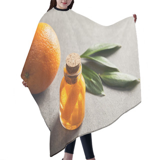 Personality  Whole Ripe Orange And Bottle With Essential Oil On Dark Surface Hair Cutting Cape