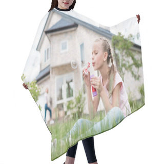 Personality  Side View Of Little Child Blowing Soap Bubbles And Sitting On Lawn While Her Mother Standing Behind In Front Of House  Hair Cutting Cape