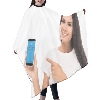 Personality  KYIV, UKRAINE - SEPTEMBER 3, 2019: Happy Woman Pointing With Finger At Smartphone With Skype App On Screen Isolated On White  Hair Cutting Cape