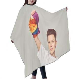 Personality  Confident Redhead Bigender Person In White T-shirt And Jeans Standing With LGBT Flag On Grey Hair Cutting Cape