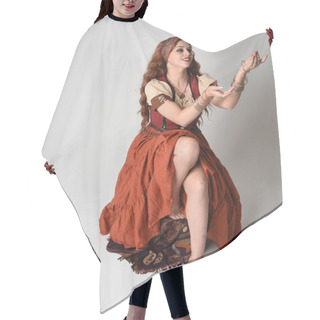 Personality  Full Length Portrait Of Beautiful Red Haired Woman Wearing A Medieval Maiden, Fortune Teller Costume.  Sitting Pose, With Gestural Hands Reaching Out. Isolated On Studio  Hair Cutting Cape